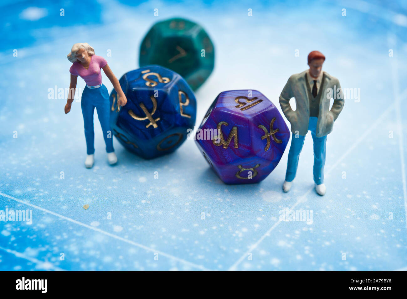 miniature figurines and esoteric dice, fortune telling concept Stock