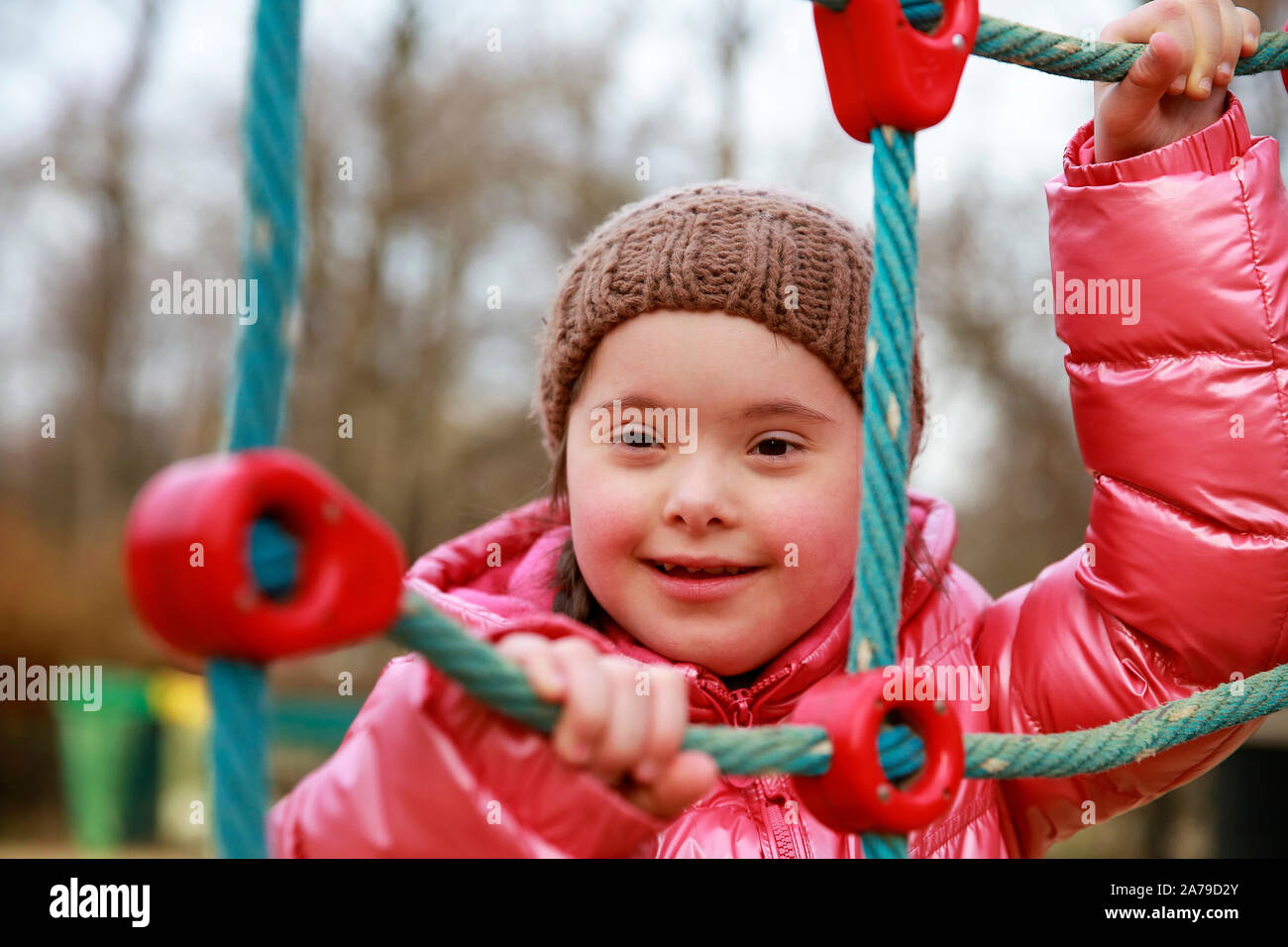 Portrait of beautiful girl on the playground Stock Photo - Alamy