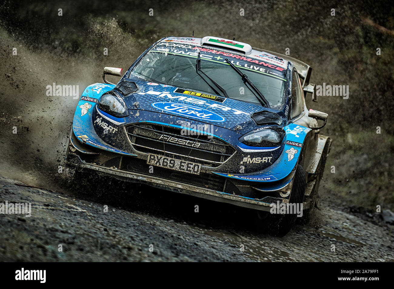 Elfyn Evans driving his Ford Fiesta through a watersplash for the M-Sport Ford Perfomance World Rally Team at the 2019 WRC Wales Rally GB, Wales, UK Stock Photo