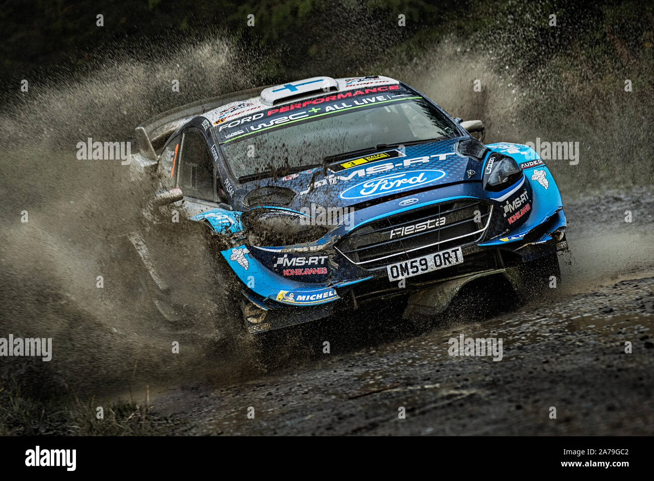 Teemu Suninen driving through a watersplash in the M-sport Ford performance world rally team in the 2019 WRC Wales Rally GB, Wales, UK Stock Photo