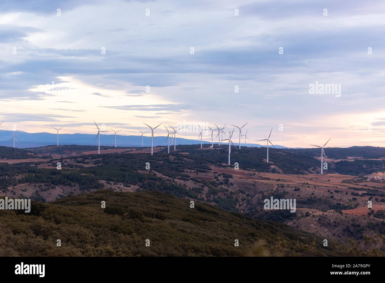 Windmill for electric power production. Landscape with Turbine Green Energy Electricity . Stock Photo