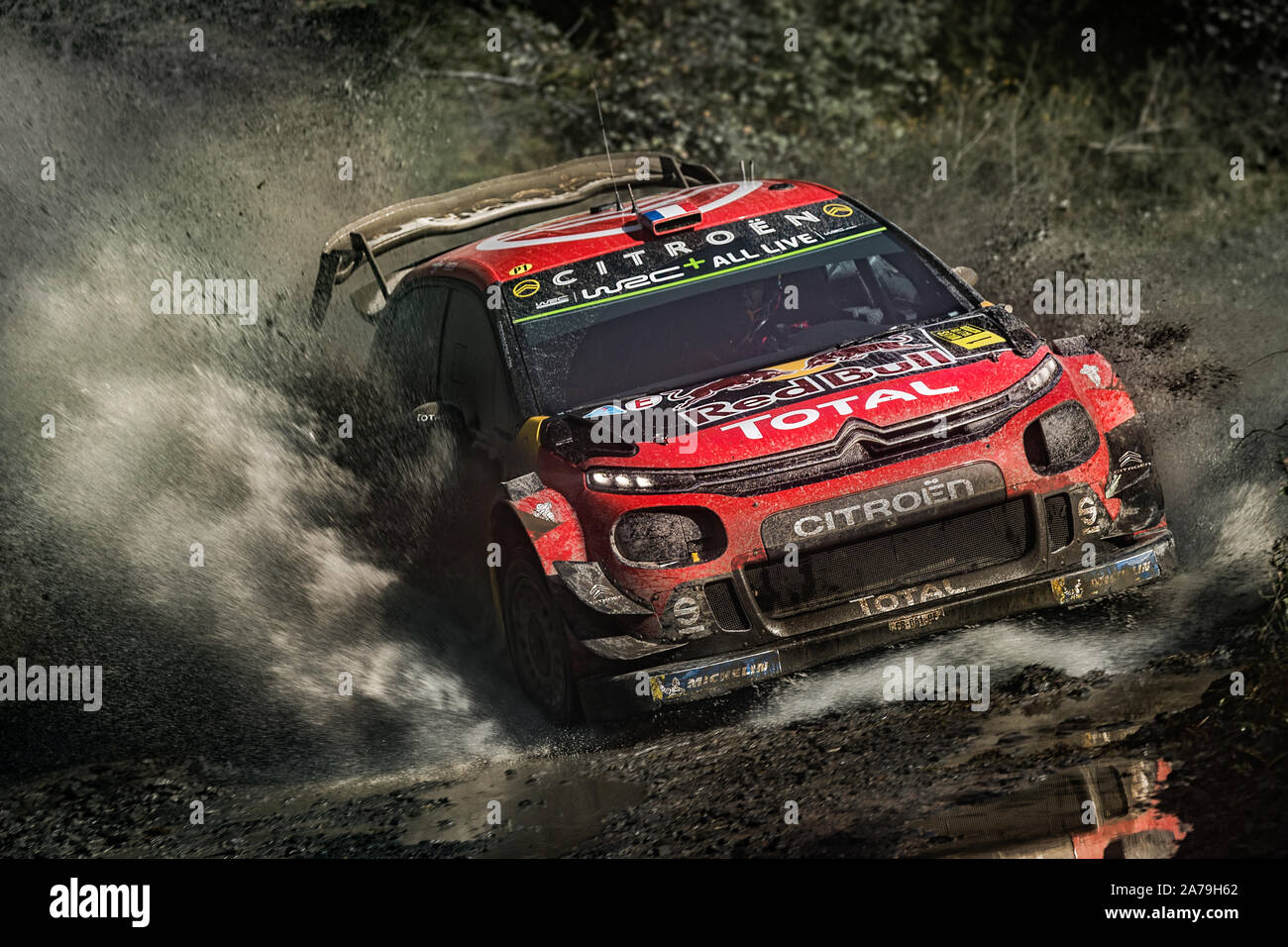 Sebastien Ogier driving through a watersplash in the 2019 WRC Wales Rally GB for Citroen Racing World Rally Team Stock Photo