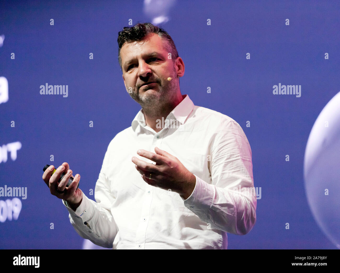 Geraint Lewis, Astrophysicist at the University of Sydney, asking the question; 'Is there anybody out there?', on the Cosmos Stage, at New Scientist Live 2019 Stock Photo
