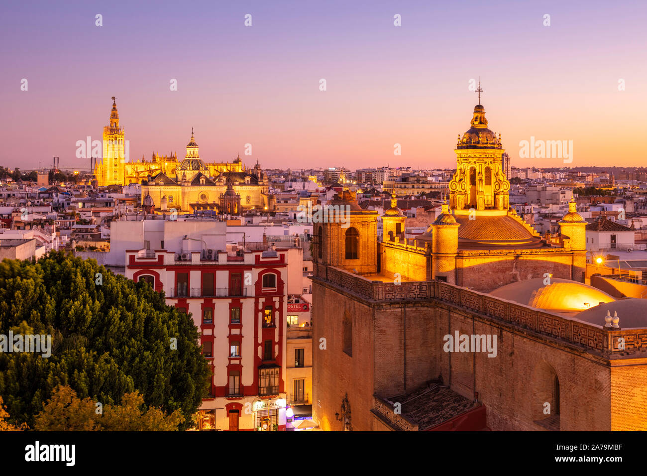 Sunset Seville skyline view of Seville cathedral La Giralda bell tower Anunciation Church and city rooftops Seville Spain Seville Andalusia Spain EU Stock Photo