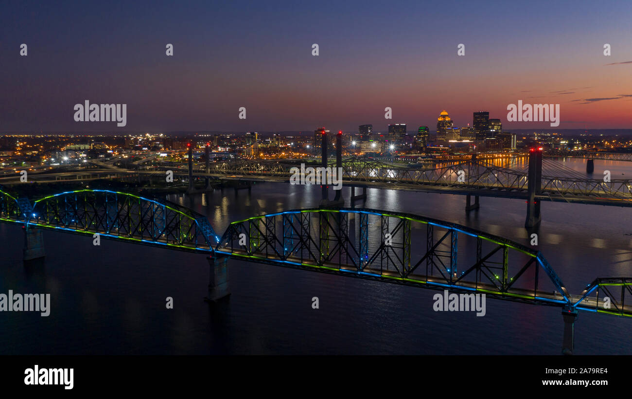 Multi Colors of light hit the Big Four bridge before sunrise around Lousville Kentucky Stock Photo