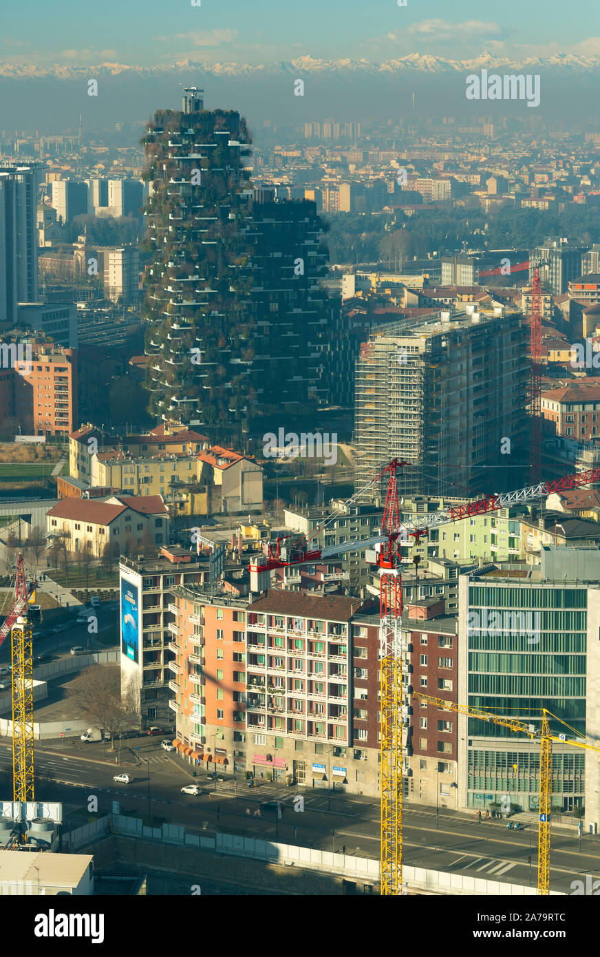 Milan skyline, aerial view of Bosco Verticale (Vertical forest) skyscrapers and the city covered by smog. Italian landscape. Stock Photo