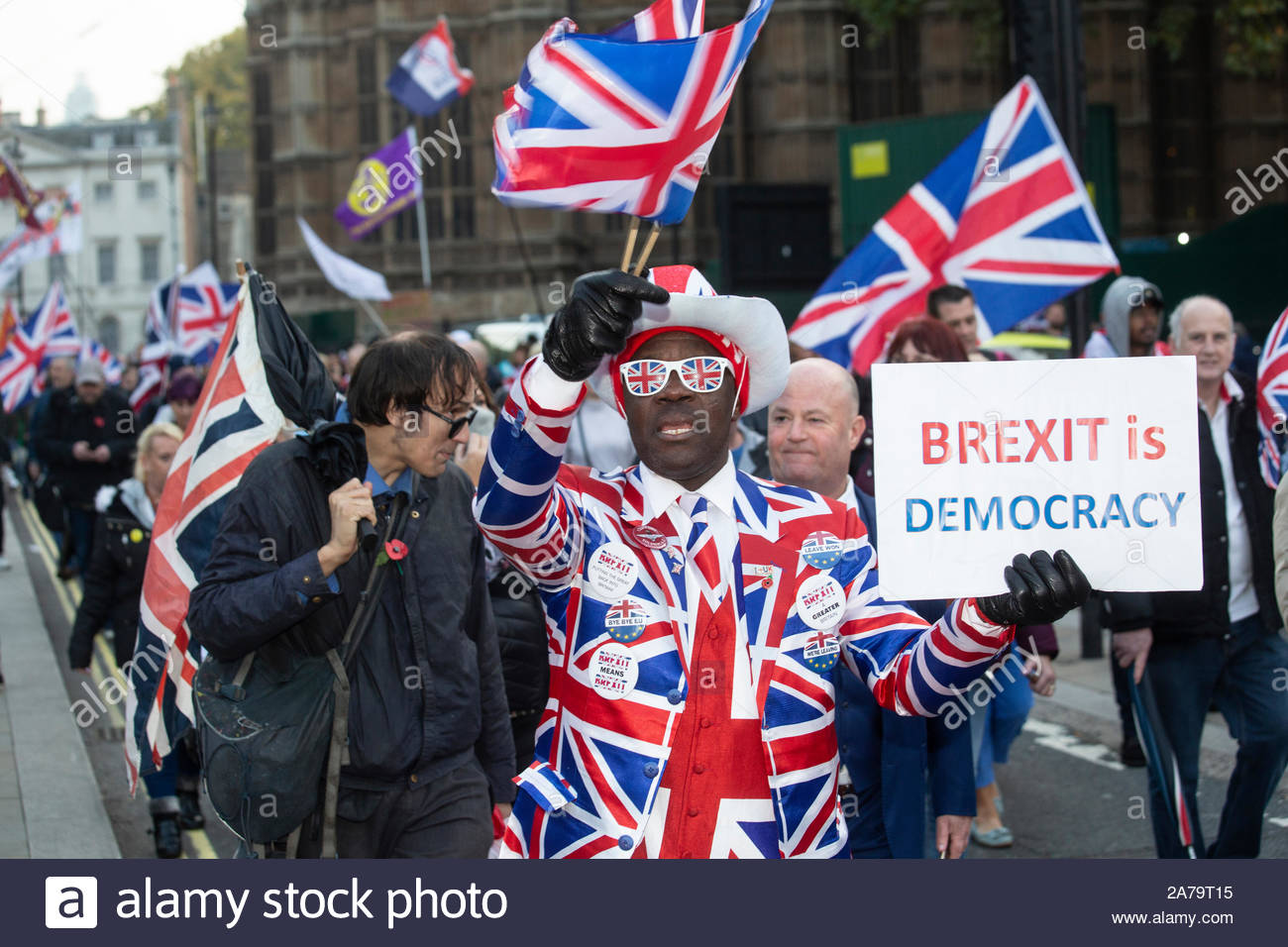 London, UK. 31st Oct, 2019. A Leave means Leave march has taken place at Westminster in protest at the failure to deliver Brexit. There wasa heavy police presence at the protest and arrests were made. Here Joseph Afrane waves a Union Jack. Credit: Clearpix/Alamy Live News Stock Photo