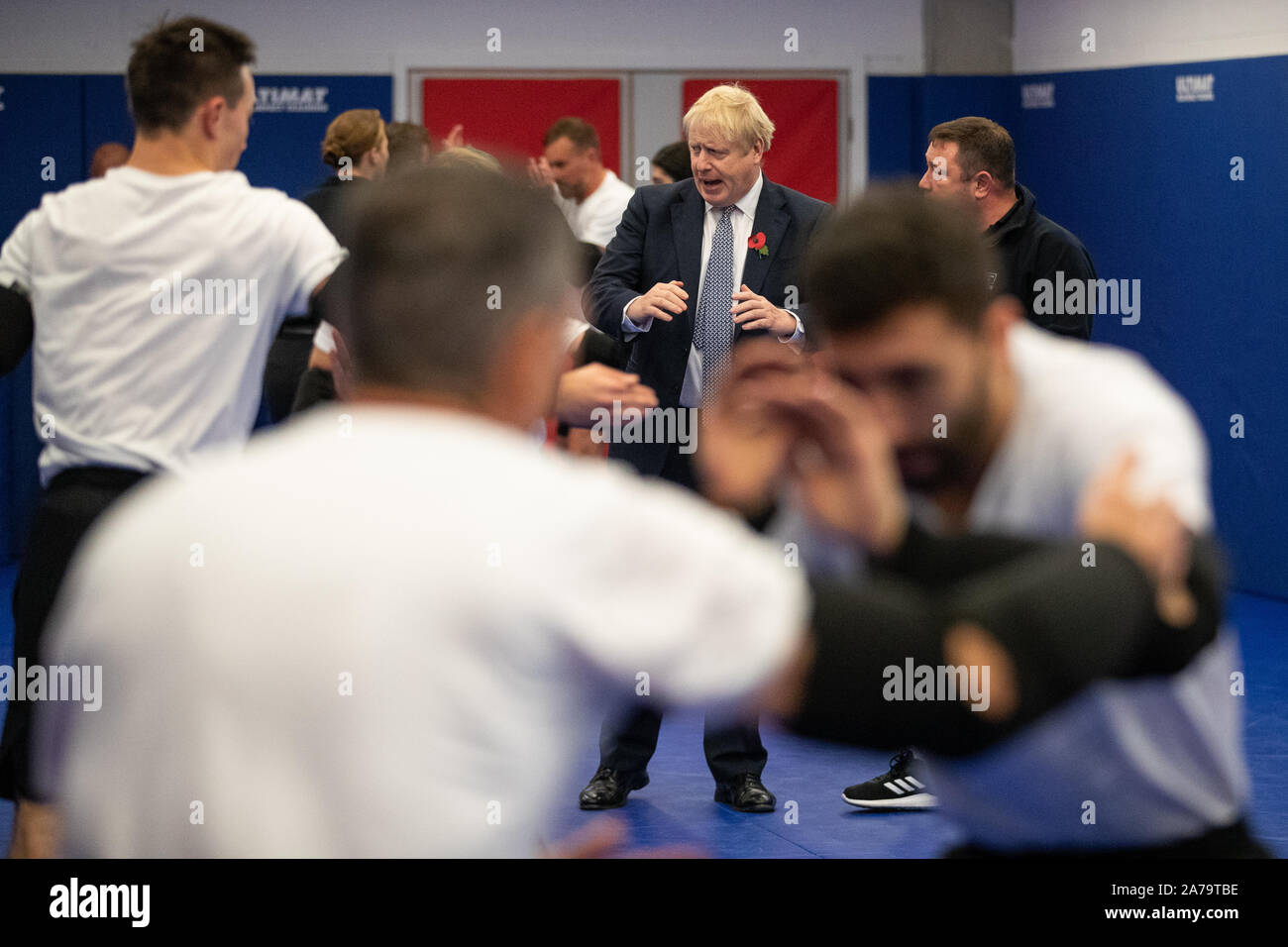 Prime Minister Boris Johnson as he observes a self defence class during a visit to Metropolitan Police training college in Hendon, north London. Stock Photo