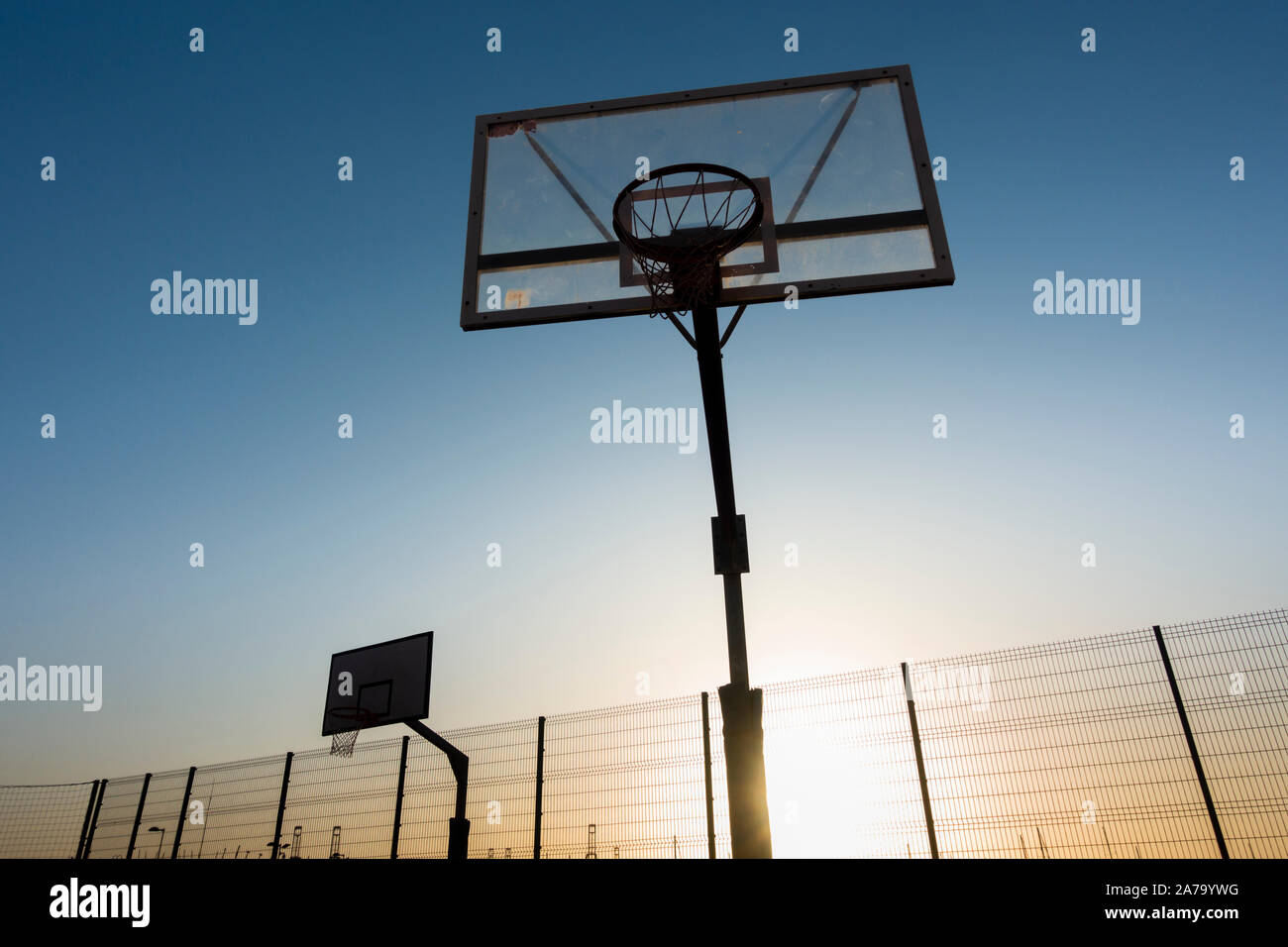 Basketball court, hoop at sunrise Stock Photo Alamy