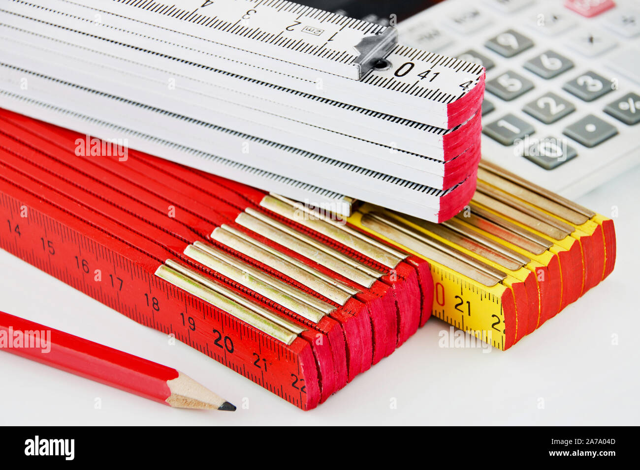 Various folding rules on white background Stock Photo Alamy