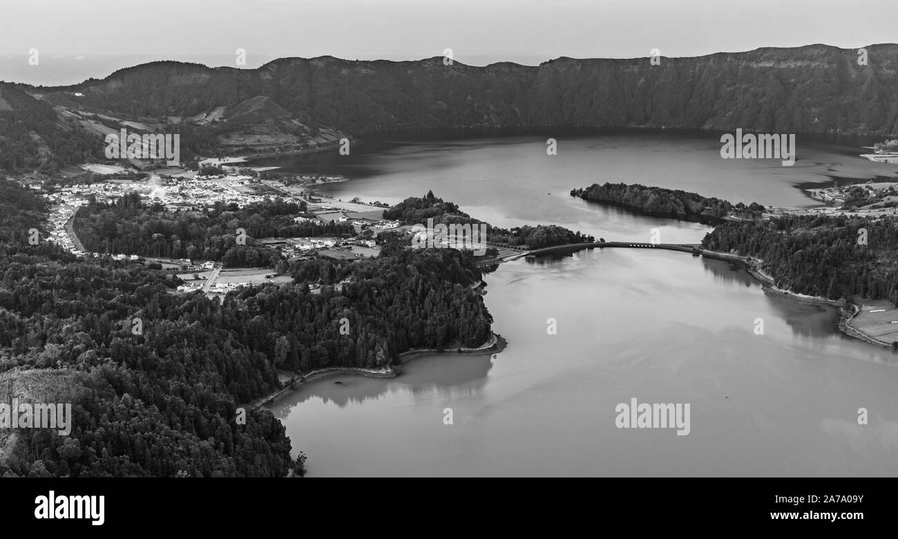 A black and white picture of the Seven Cities Lake (Lagoa das Sete Cidades) at sunset. Stock Photo
