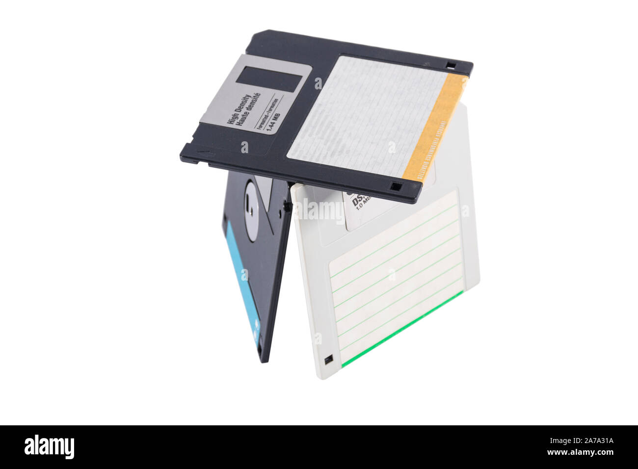 Old computer diskettes in a construction isolated on white background