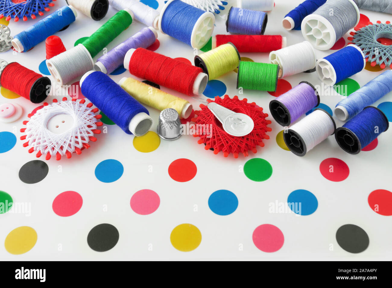 Sewing kit and sewing thread as one background Stock Photo