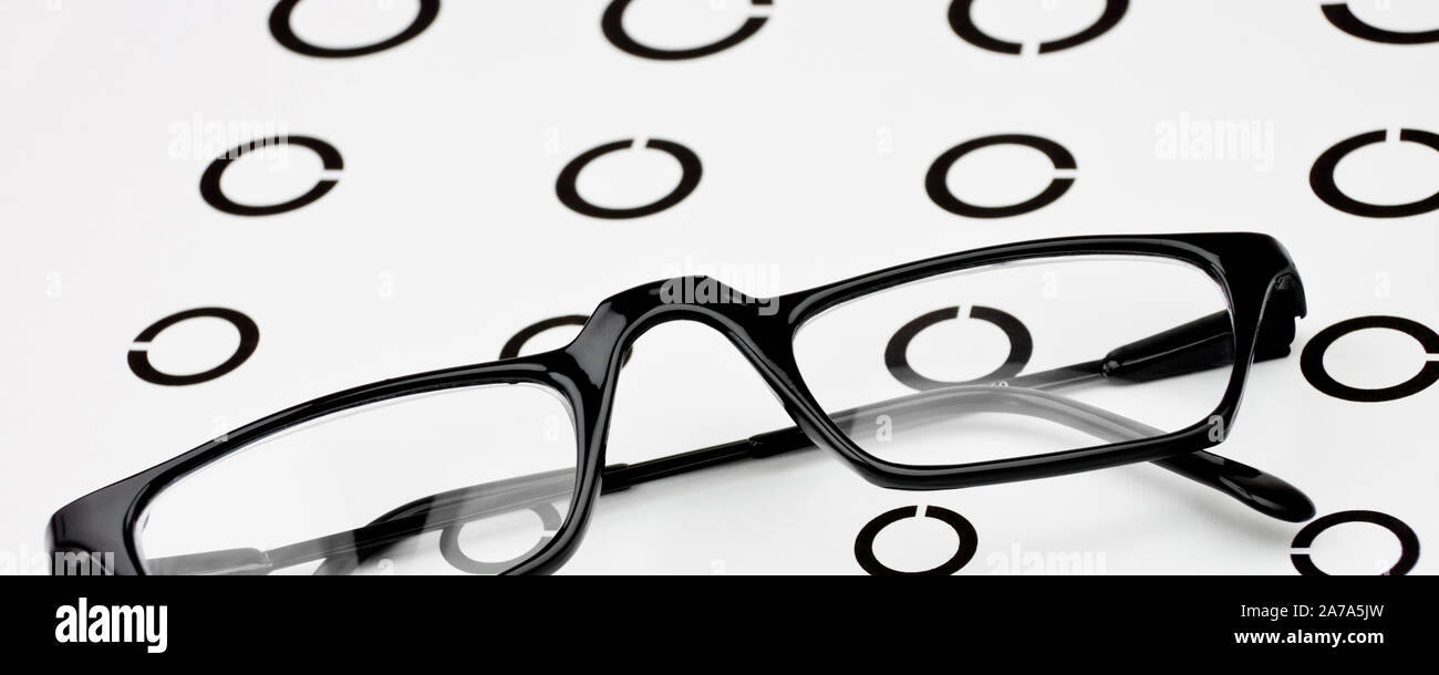 Eye test with glasses and letters Stock Photo Alamy