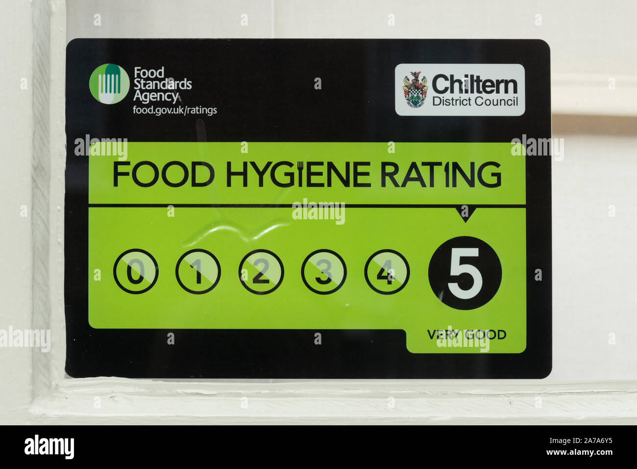 Food hygiene rating 5, top rating symbol on the exterior of a restaurant, UK Stock Photo
