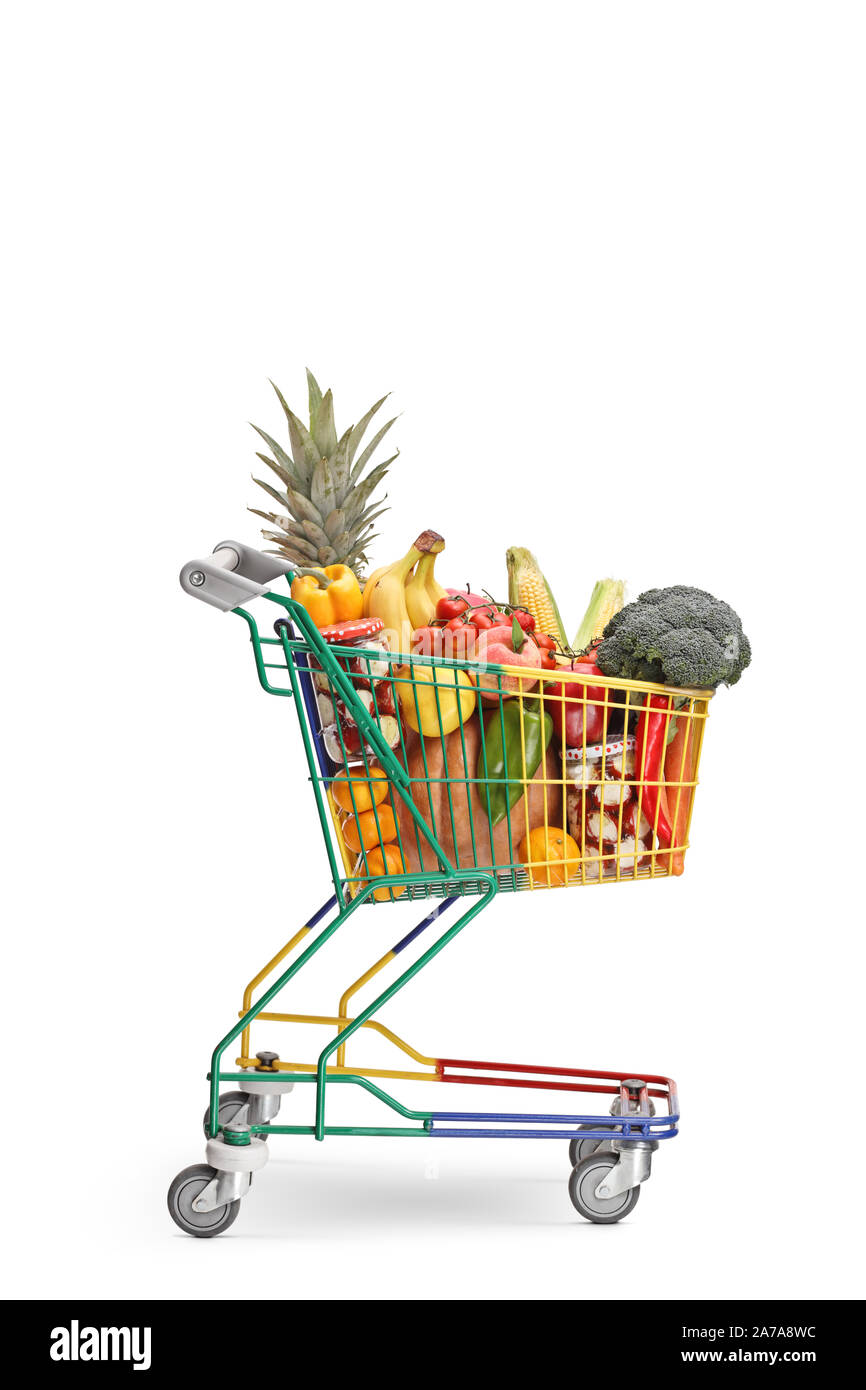 Studio shot of a little shopping cart full of healthy food products isolated on white background Stock Photo