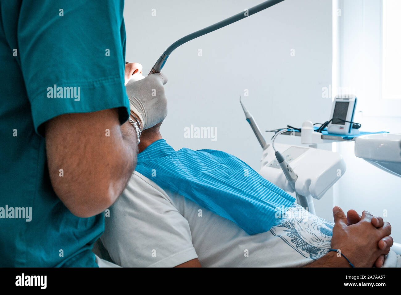 Italian people, medicine, stomatology and health care concept dentist with patient talking at