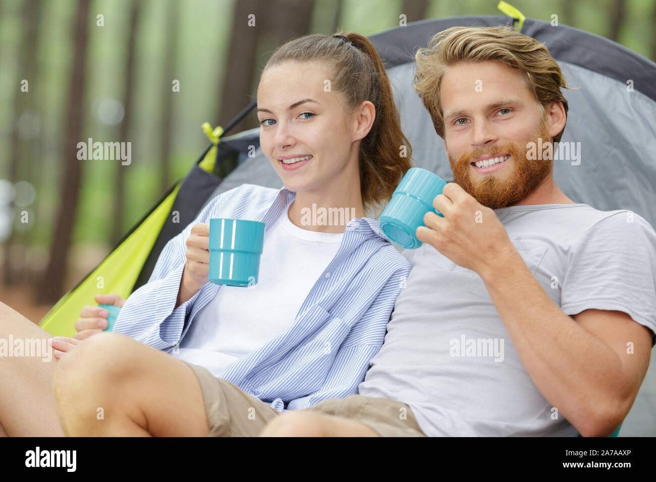 Family doing camping in forest hi-res stock photography and images - Alamy