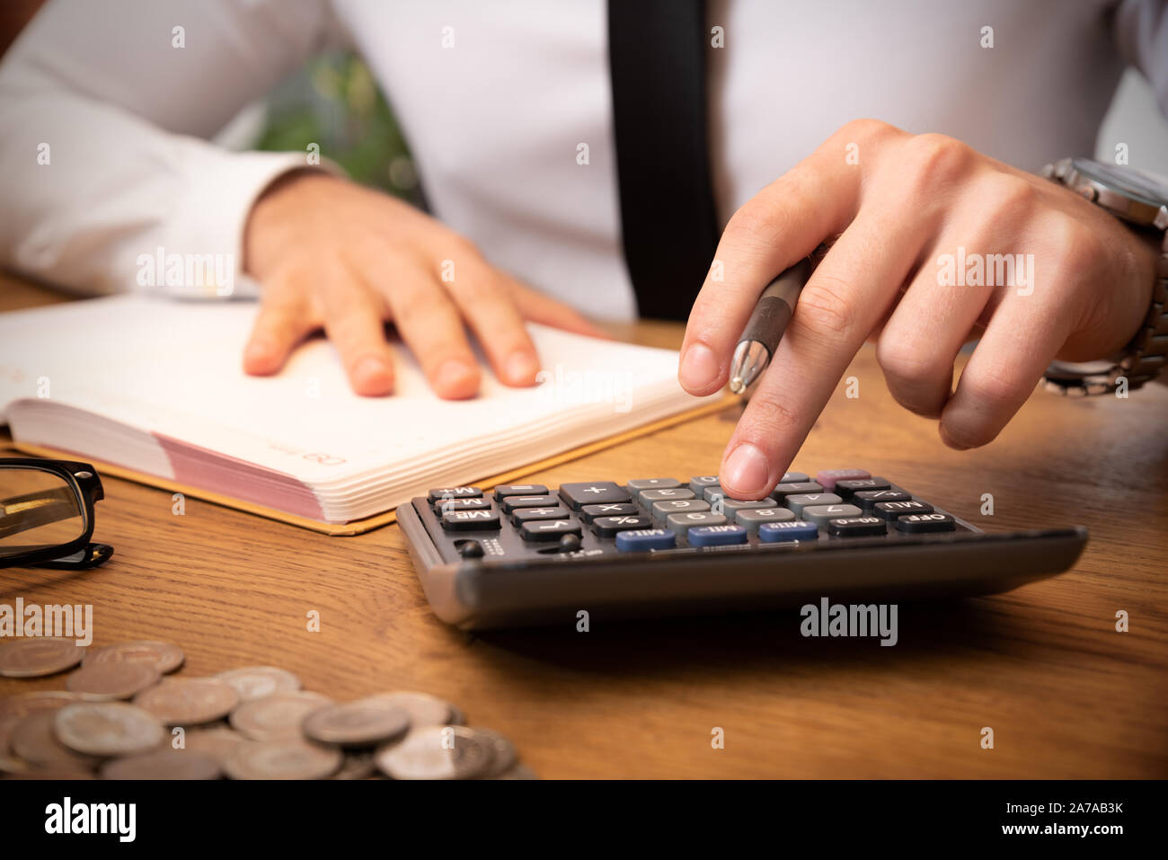 Accountant calculate tax information or business data. Businessman working in office Stock Photo