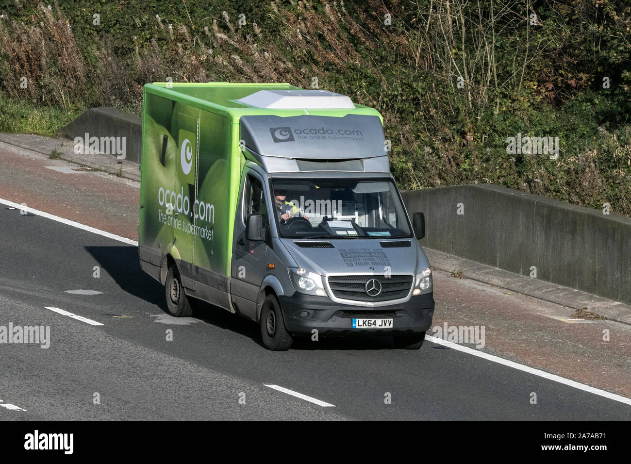 Ocado groceries online food delivery Mercedes Sprinter on the M6 at