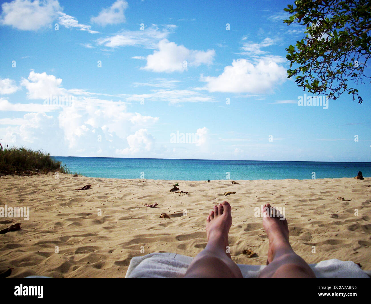 feets view from the beach in jamaica on the blue ocean Stock Photo