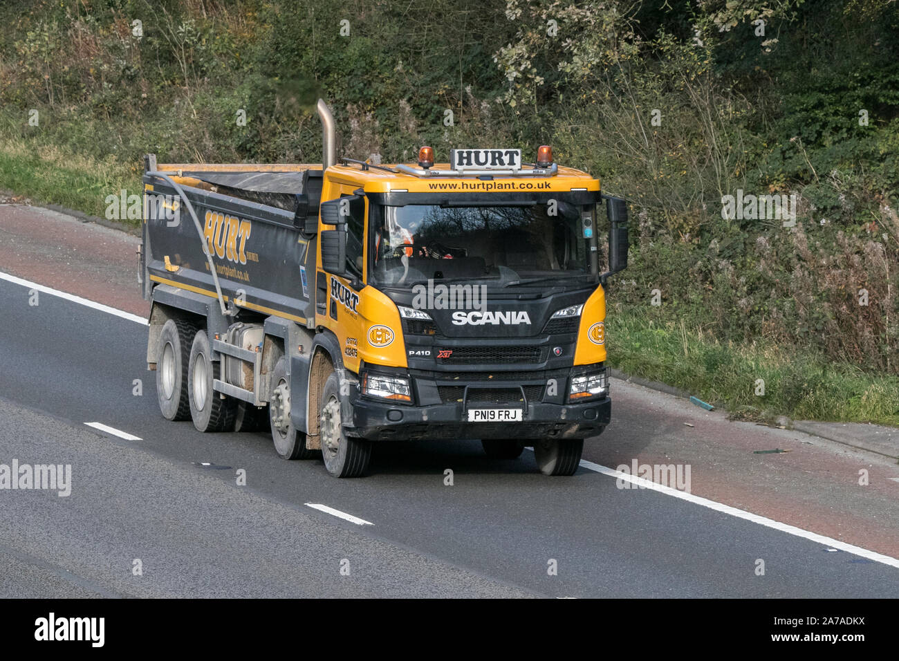 A Hurt Plant hire Scania P410 XT carrying aggregates for construction Stock Photo