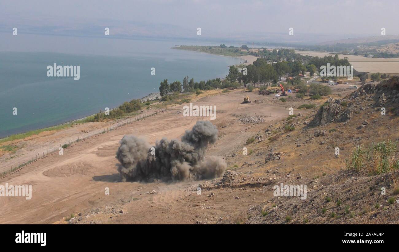 Enginers of 4M defense with protective gear inspecting an old Syrian minefield just before clearing the mines on Gofra beach in the sea of Galilee, Israel Stock Photo