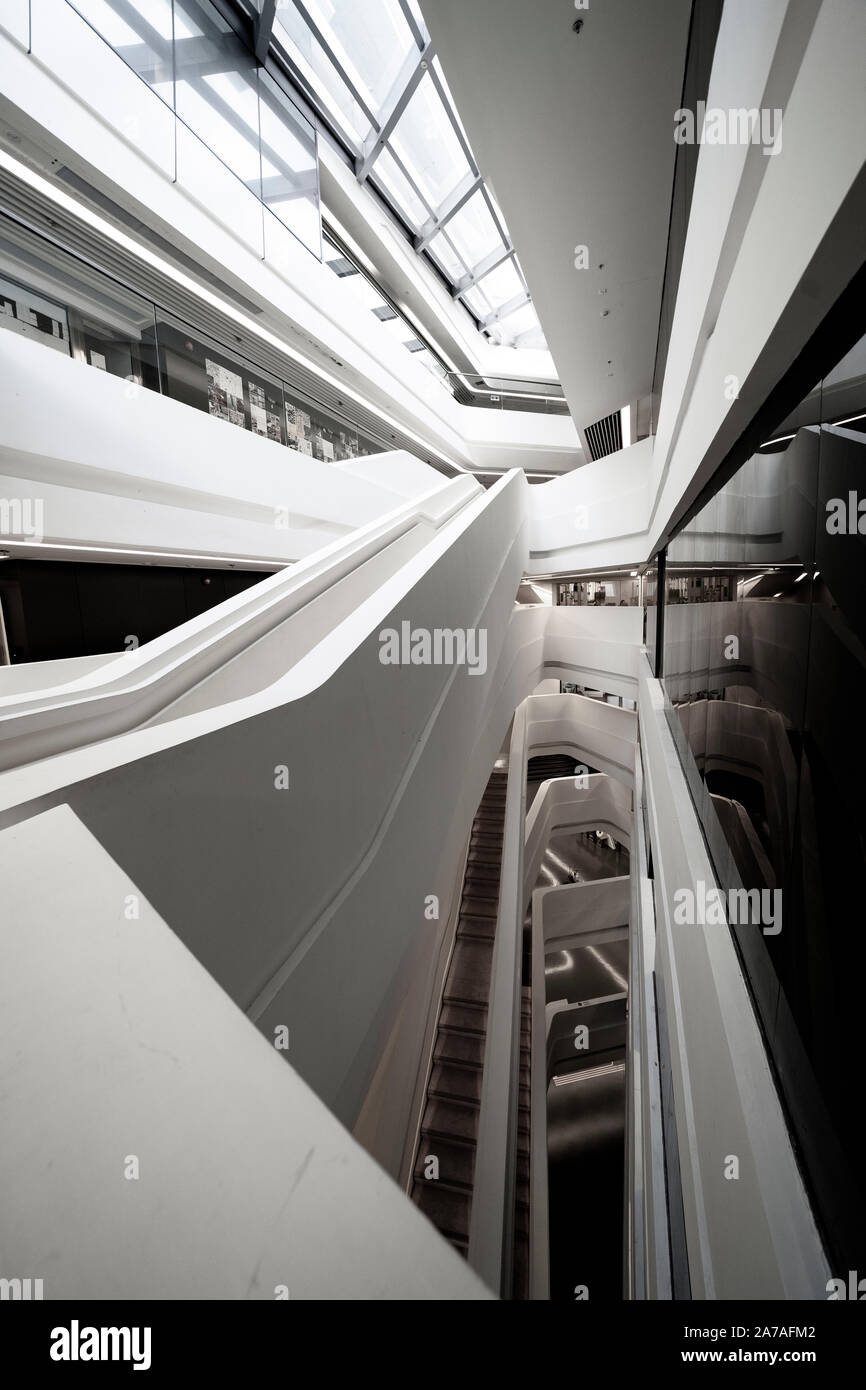 Interior of modern architecture of PolyU School of Design Jockey Club Innovation Tower at Hong Kong Polytechnic University, Hong Kong. Architect Zaha Stock Photo