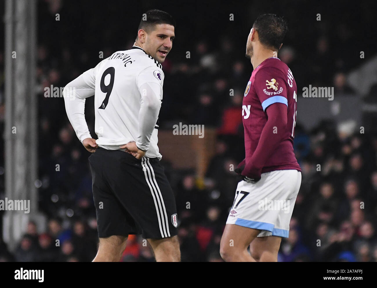 LONDON, ENGLAND - DECEMBER 15, 2018: Aleksandar Mitrovic of Fulham (L) and Javier Hernandez Balcazar (Chicharito) of West Ham (R) pictured during the 2018/19 Premier League game between Fulham FC and West Ham United at Craven Cottage. Stock Photo