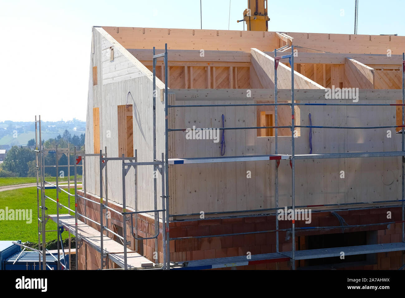 Framehouse with solid wooden walls is being built on bricks Stock Photo