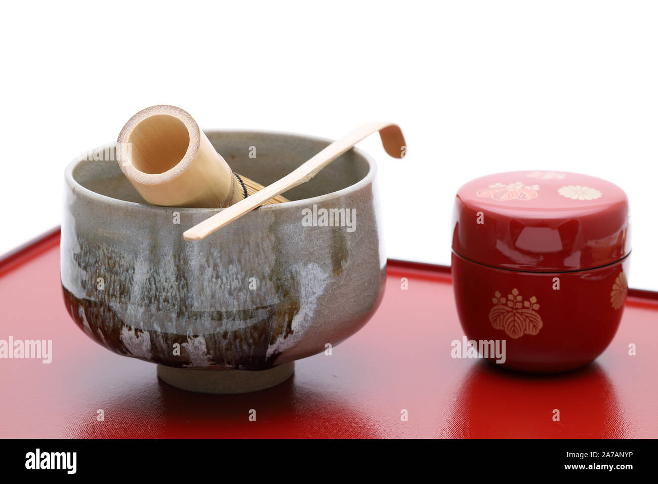 Tea bowl with tea whisk and bamboo spoon used in Japanese matcha green tea ceremony Stock Photo