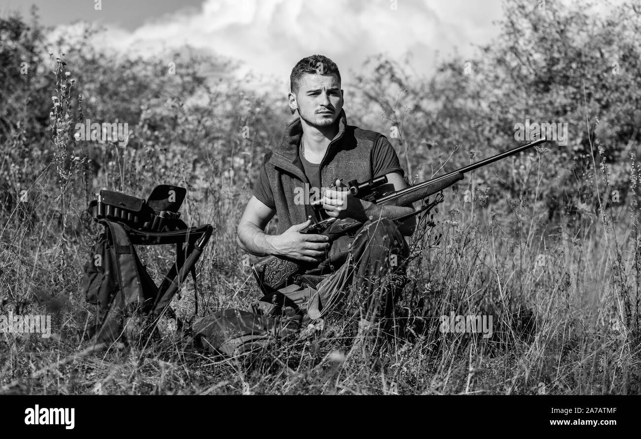 Recharge rifle concept. Man with rifle hunting equipment nature