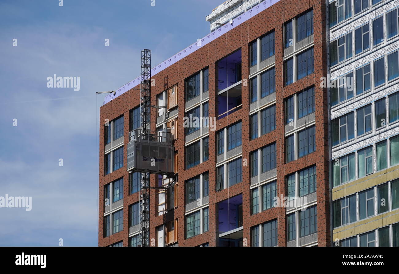 Arlington, VA / USA - September 23, 2019: Scaffolding Resource brand elevator near the top of a building Stock Photo