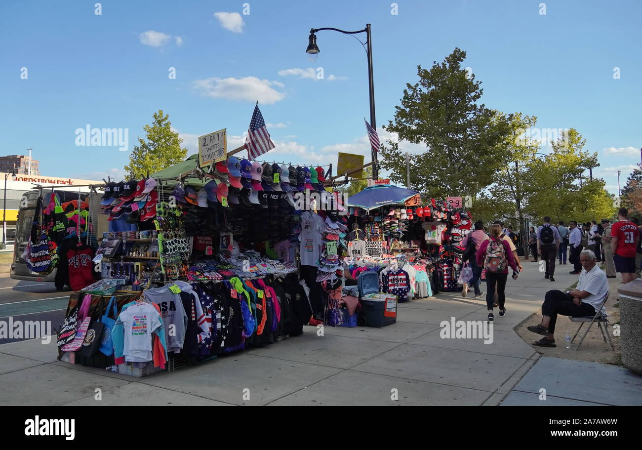 Alexandria, VA / USA - September 24, 2019: Vendor selling t shirts, hoodies, and other souvenirs streetside in Pentagon City Stock Photo