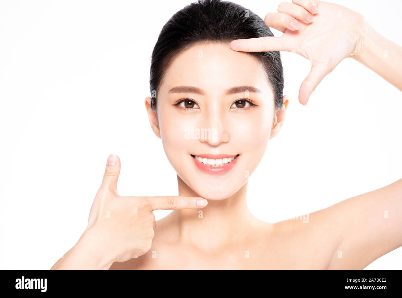 Closeup of Smiling beauty  Making Frame Gesture Stock Photo