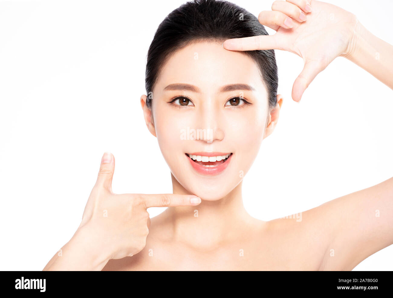 Closeup of Smiling beauty  Making Frame Gesture Stock Photo