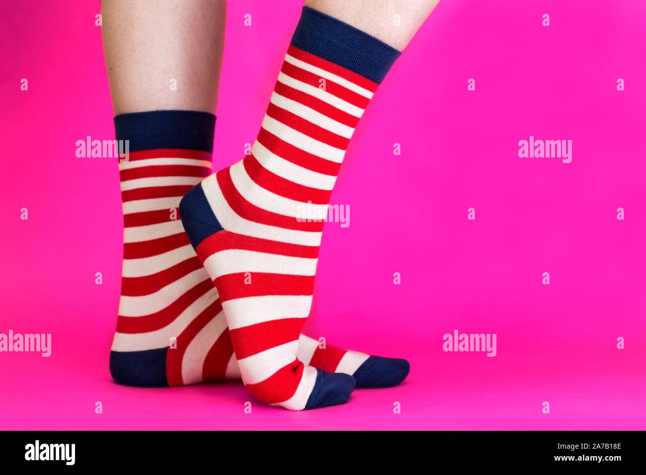 striped bright socks on a pink background Stock Photo