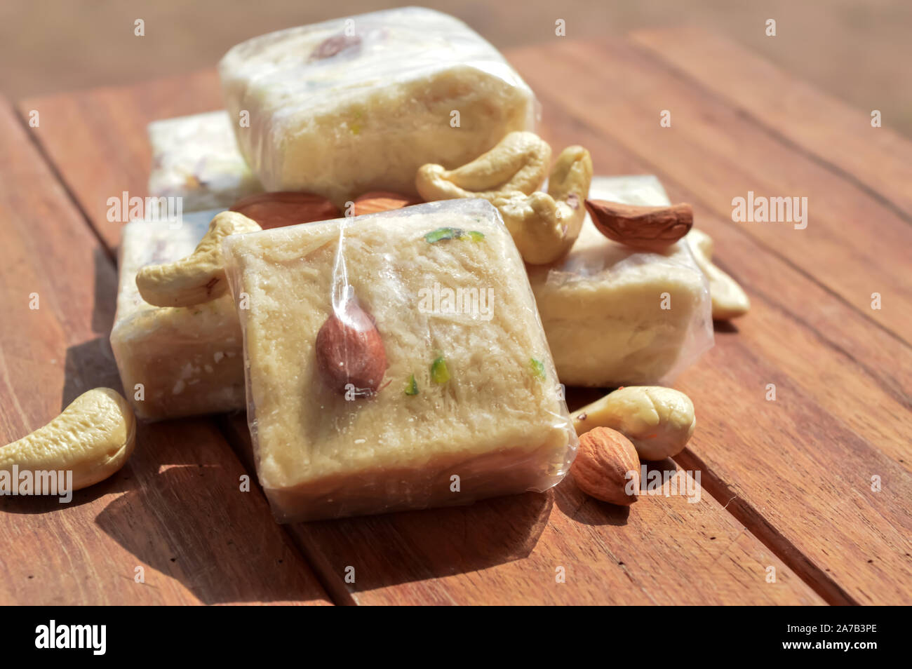 Served with almonds and pistachio in a plate over moody background. sonpapdi Stock Photo