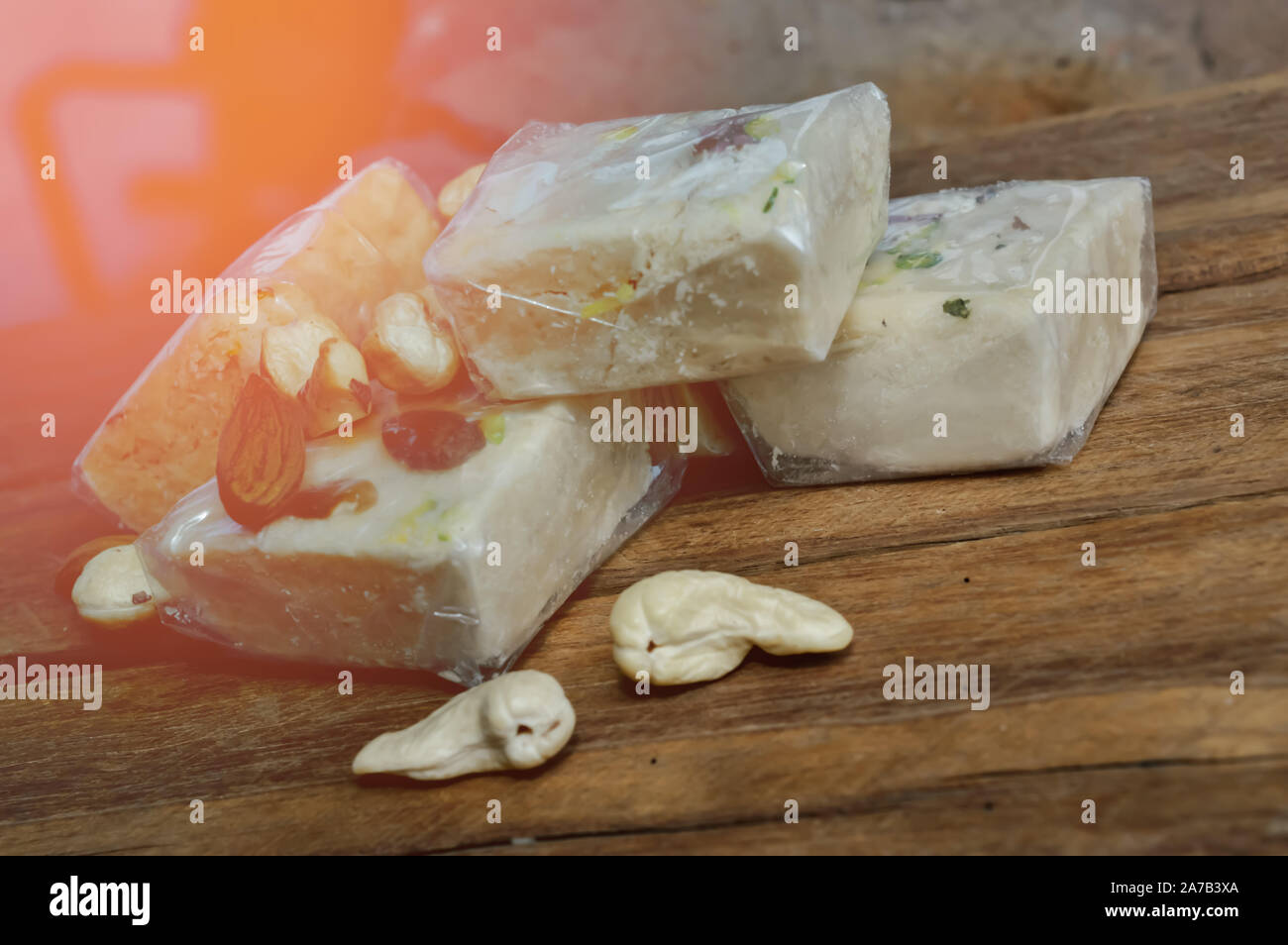 soanpapdi top view,sonpapdi and nuts on wooden table Stock Photo