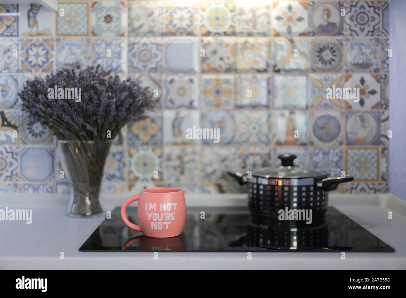 Cooking in the kitchen. Saucepan on the ceramic hob at home Stock Photo