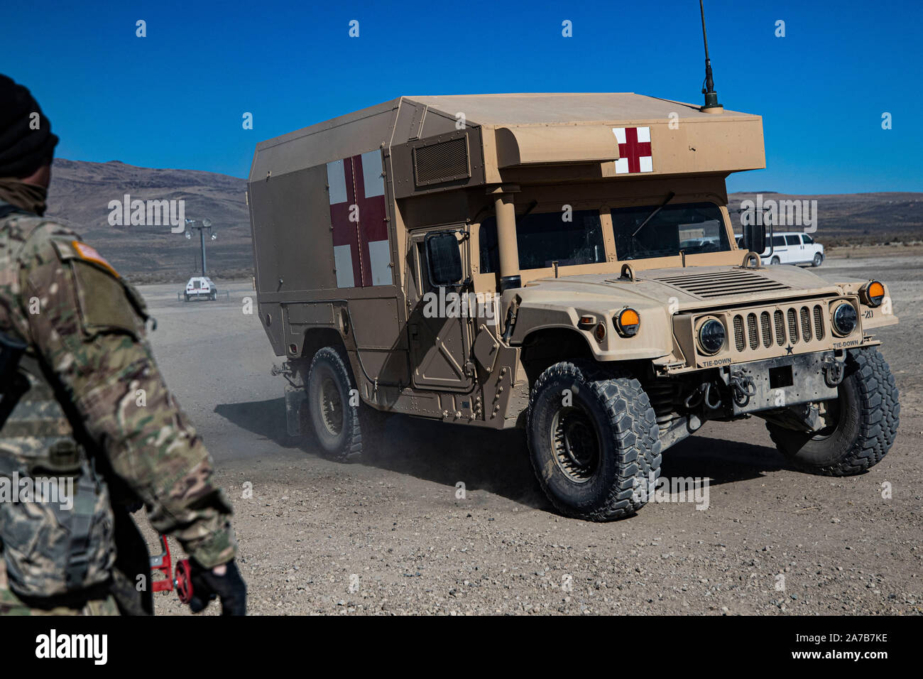 A field litter ambulance (FLA) with simulated patients arrives to the emergency medical tent of the field hospital at Sierra Army Depot, California, during the United States Forces Command Medical Emergency Deployment Readiness Exercise, Oct. 29, 2019. The FLA is equipped with basic armor and is used to transport casualties from the battlefield to the medical facilities. Stock Photo