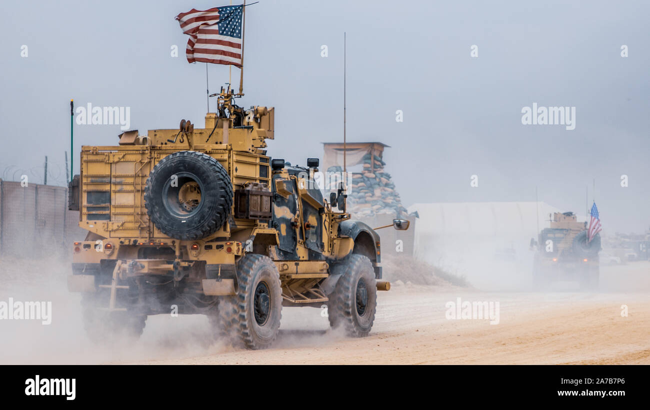 U.S. Soldiers and Marines attached to the Special Purpose Marine Air-Ground Task Force – Crisis Response – Central Command (SPMAGTF-CR-CC) 19.2, drive a joint light tactical vehicle (JLTV) at an undisclosed location in Syria, October. 16, 2019. The SPMAGTF-CR-CC is multiple force provider designed to employ ground, logistics, and air capabilities throughout the central command area of responsibility. (U.S. Marine Corps photo by Sgt. Branden J. Bourque) Stock Photo
