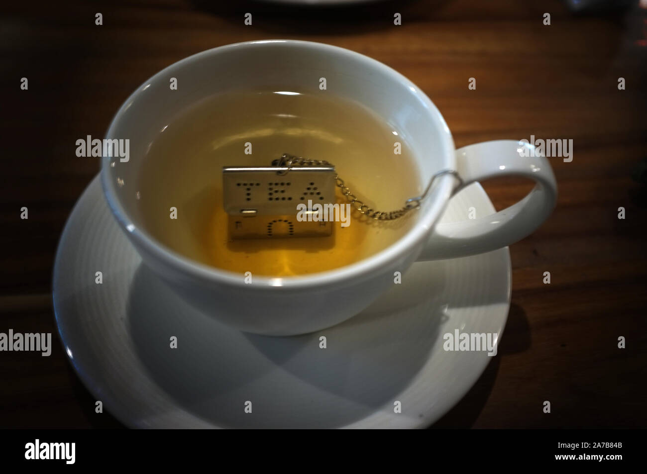 Cup of tea with House Shape Tea Strainers Stainless Steel Tea Infusers Stock Photo Alamy