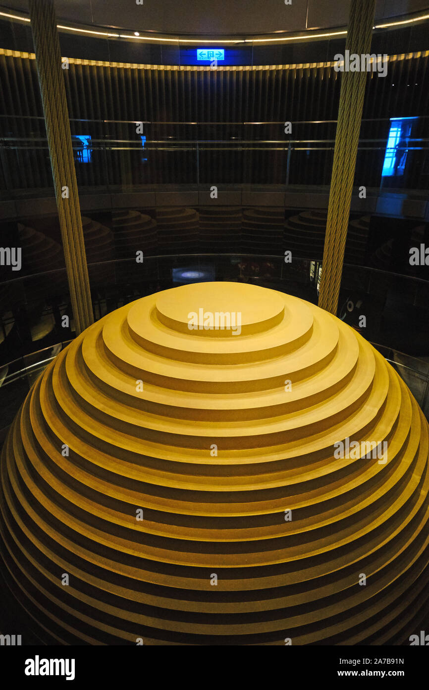 The 660-tonne Tuned Mass Damper is suspended from the 92nd to the 87th floor in Taipei 101 to offset movements in the building caused by strong gusts. Stock Photo