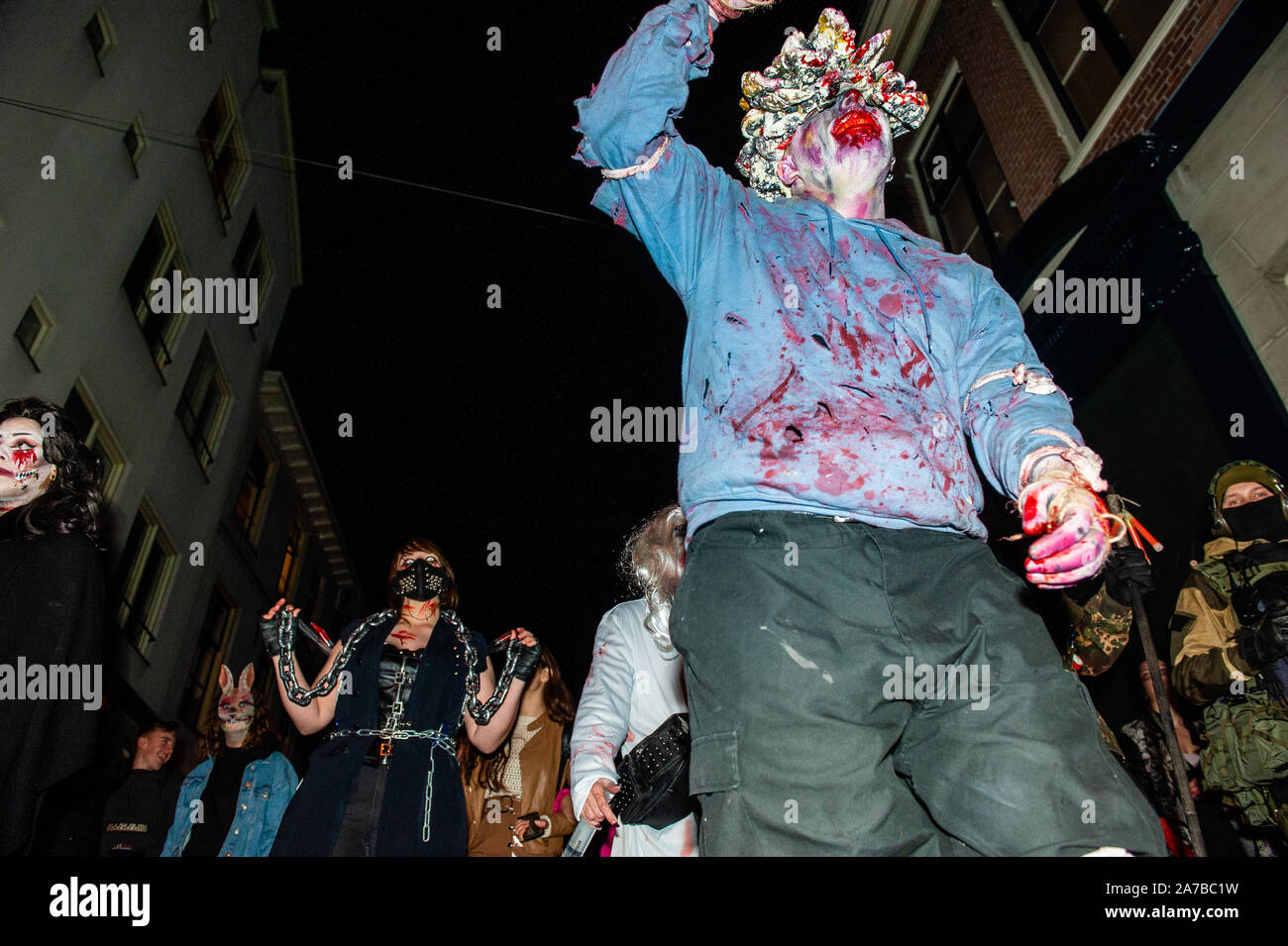 Arnhem, Netherlands. 31st Oct, 2019. Several zombies are seen walking on the streets.As in previous years, the Zombie Walk took place around the center of Arnhem. The walk started at the live music venue Willemeen, where makeup artists were creating their zombie makeups. Hundreds of zombies staggered through the inner city in search of fresh brains during the ultimate Halloween Parade. Credit: SOPA Images Limited/Alamy Live News Stock Photo