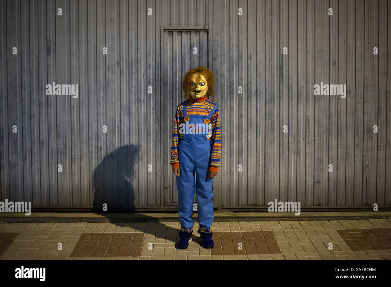 A boy dressed up as a 'Chucky' poses for a photo during the VI edition of  \, image size:1300x955