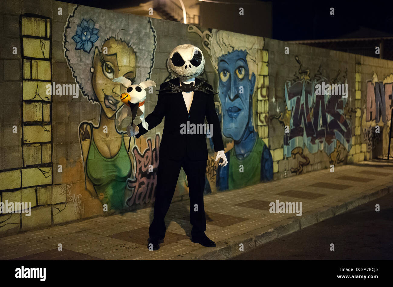 Malaga, Spain. 31st Oct, 2019. A man dressed up as Jack Skellington poses for a photo during the VI edition of 'Churriana Noche del Terror' (Churriana Horror Night) to celebrate the Halloween night in the neighbourhood of Churriana.Residents of Churriana participate in the Halloween day dressed with horrific costumes, decorating their houses and with scary performances along the streets. The 'Churriana Horror Night' is one the most popular event in the city to marks the Halloween Day, and for this occasion the theme of the edition is the witches. Credit: SOPA Images Limited/Alamy Live News Stock Photo