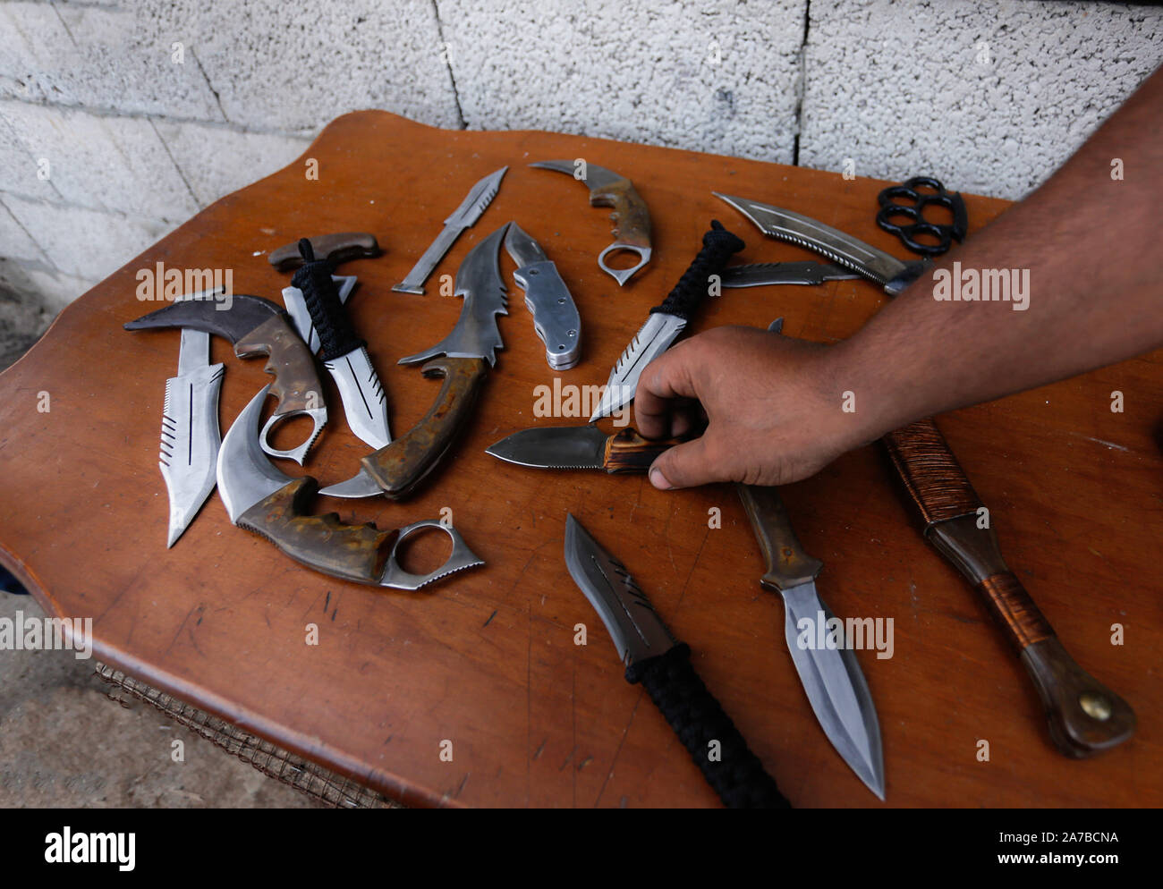 Gaza, Palestine. 29th Oct, 2019. Saif Abu Azza, a Palestinian Sword and Daggers Maker shows off the daggers at his workshop in Khan Younis.The sword and dagger are the oldest weapons that a man used to defend himself in ancient times and they are considered as the ancient fighting tools. They are used as artifacts and some tribes in different religions use them as a symbolic weapons. Credit: Yousef Masoud/SOPA Images/ZUMA Wire/Alamy Live News Stock Photo