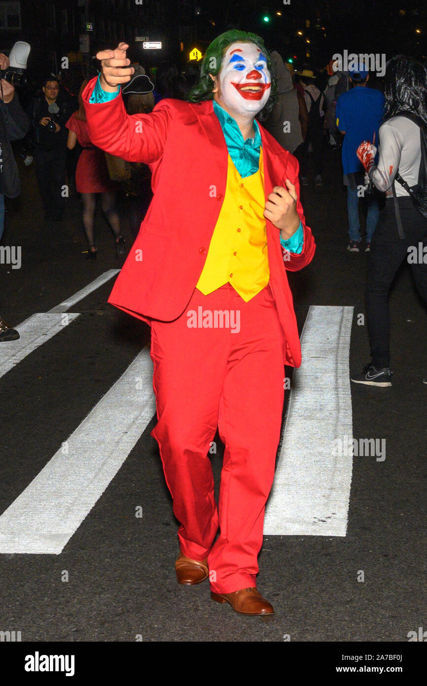 New York, USA, 31 October 2019. A reveler wearing a Joker costume dances during the 46th NYC's Village Halloween Parade in New York City. Credit: Enrique Shore/Alamy Live News Stock Photo - Alamy