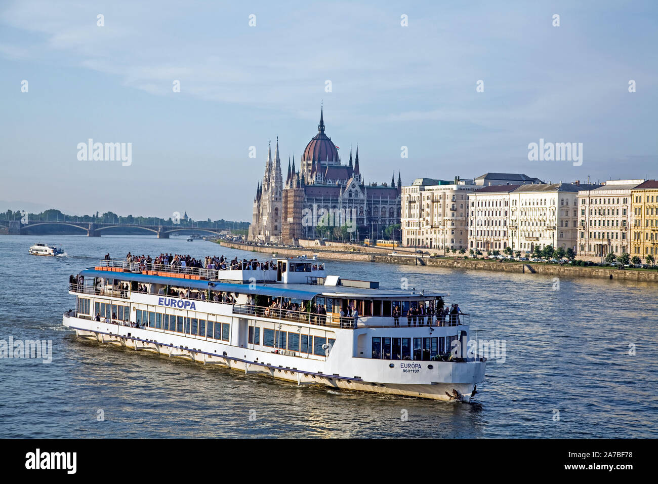 Passenger boat sailing down the Danube River with the Hungarian Parliament buildings in the background. Stock Photo